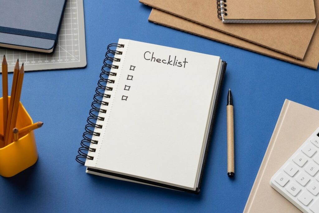 top view notebook with checklist on desk
